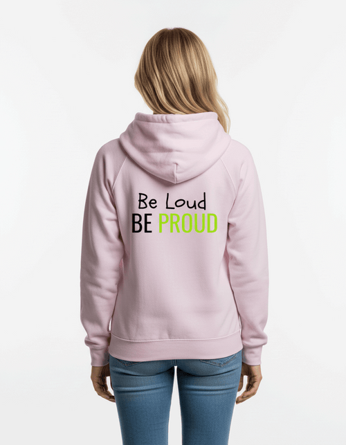 Light pink ultra-soft sensory-friendly hoodie with 'Be Loud BE PROUD' text in black and neon green, designed for neurodivergent self-expression.